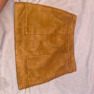 Camel color skirt, zipper on the sides IT HAS POCKETS! It’s a medium